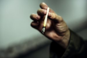 Homeless Man Hand Holding Cigarette